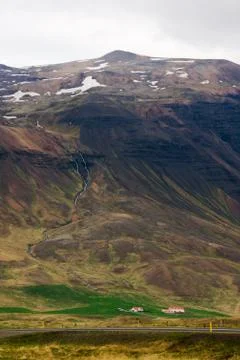 Icelandic landscape with deep valleys and scattered farms. Stock Photos