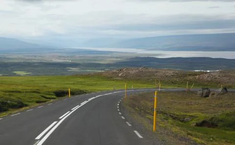 Icelandic road with clouds Stock Photos