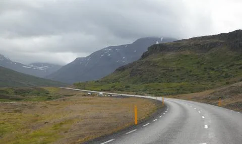 Icelandic road with clouds Stock Photos