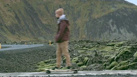 Icelandic road with a mountain in the background Stock Footage 258082437