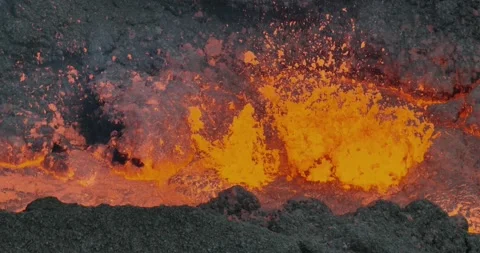 Icelandic Volcano eruption with glowing Red lava bursting to the surface Stock Footage 310160656