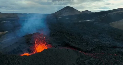 Icelandic Volcano eruption with glowing Red lava bursting to the surface Stock Footage 310160673