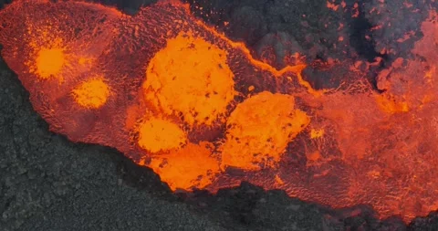 Icelandic Volcano eruption with glowing Red lava bursting to the surface Stock Footage 310160693