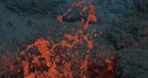 Icelandic Volcano eruption with glowing Red lava bursting to the surface Stock Footage 310160697