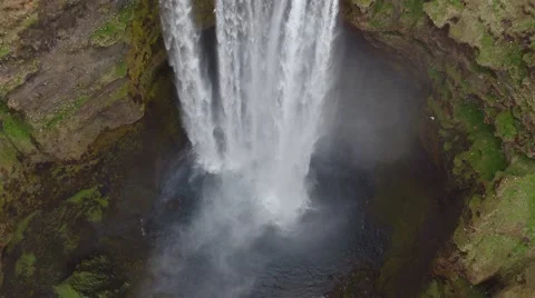 ICELANDIC WATERFALL DRONE LOOKING DOWN SKOGAFOSS Stock Footage 67602366