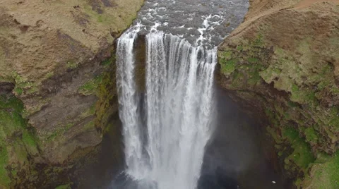 ICELANDIC WATERFALL DRONE PANNING DOWN SKOGAFOSS Stock Footage 67607240