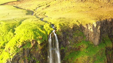 Icelandic waterfall, filmed from aerial perspective with dramatic camera view Stock Footage 111431153