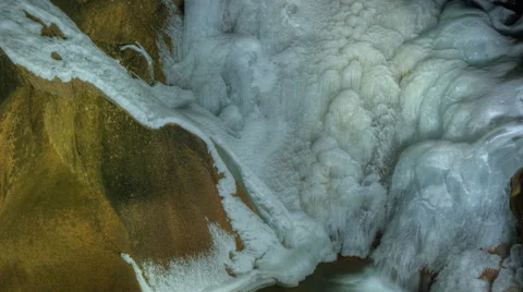 Icey waterfall into pond Timelapse 4k Stock Footage 59081698