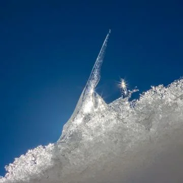 Icicle on a background of the sky Stock Photos