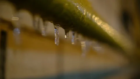 Icicle on drain pipe of the building. close up Video stock 292159315