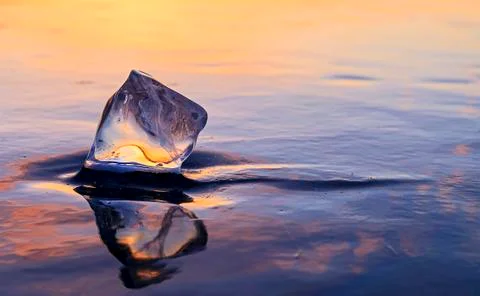 Icicle on the ice at sunset Stock Photos