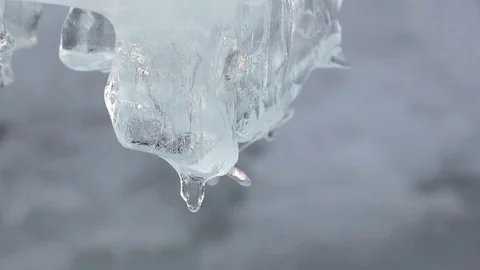 Icicle on ice of the thawing river in the spring Stock Footage 73561510