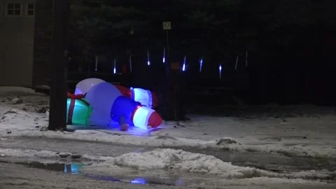 Icicle lights on a fallen Santa Stock Footage 144629226