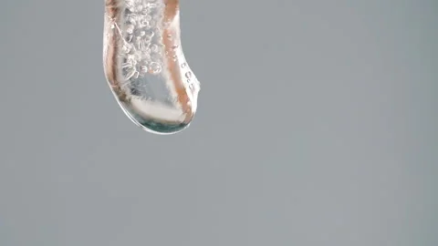 Icicle melts and drips in spring Stock Footage 116669636