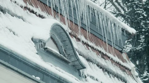 Icicles 003 on rooftop with window, snow and falling snow in vienna Stock Footage 45701688
