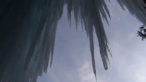 Icicles against daytime sky in Alberta Stock Footage 90838655