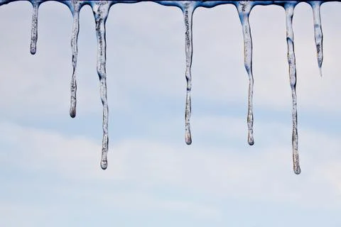 Icicles against the sky background Foto stock