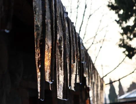 Icicles and sunlight reflected on it Stock Photos