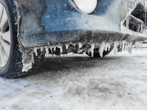 Icicles Are Forming under a Car bumper in Harsh Winter Conditions and Cold .. Stock Photos