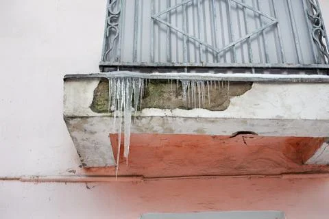 Icicles on balcony Stock Photos