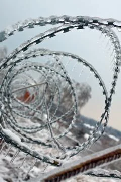 Icicles on barbed wire Stock Photos