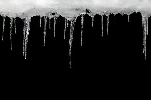 Icicles on a black background, space for text, template for design 스톡 사진