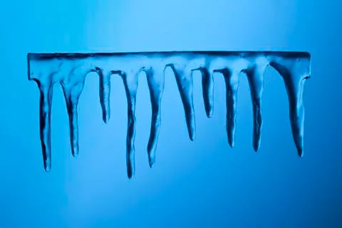 Icicles on blue background Stock Illustration