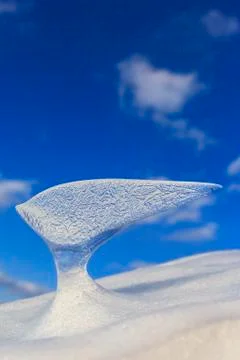 Icicles on blue sky background Stock Photos