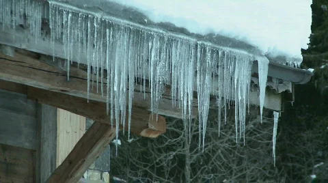 Icicles on chalet Stock Footage