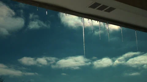 Icicles with clouds Stock Footage 32286067