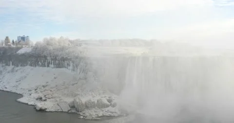 Icicles covering Niagara falls during cold winter day Stock Footage 229599119