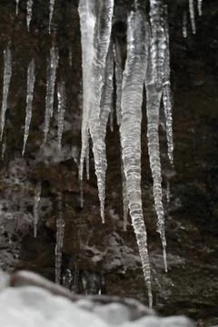 Icicles on dark background Foto stock