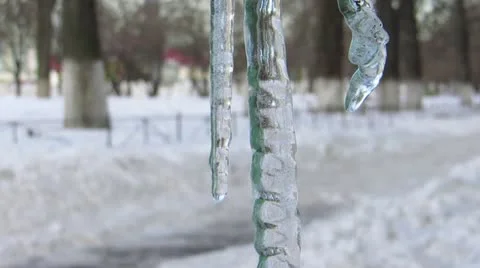 Icicles Dripping and Melting in Spring City, with sound HD Stock Footage 22261649