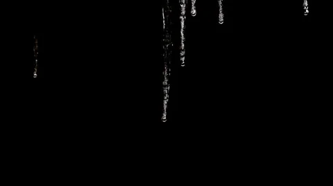 Icicles Dripping. Black background. Video stock 35742163