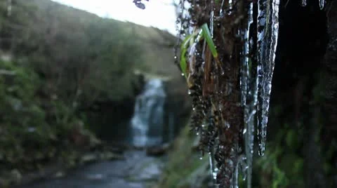 Icicles dripping  from cliff 3 140112 Video stock 10610233