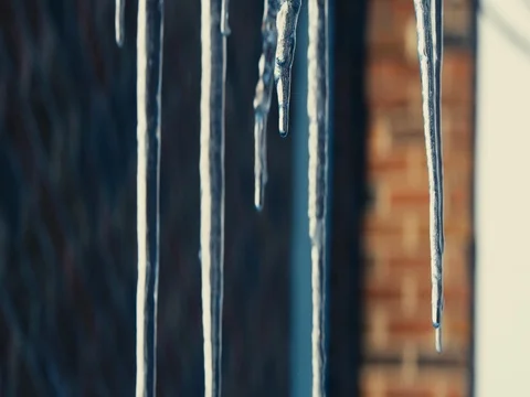Icicles dripping in slow motion, tracking shot on RED EPIC Video stock 84910252