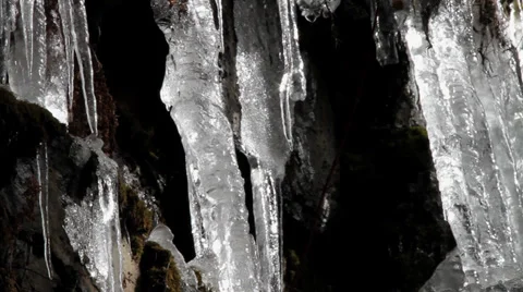 Icicles dripping water in a cave Stock Footage 32404207