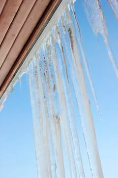 Icicles on the eaves Stock Photos