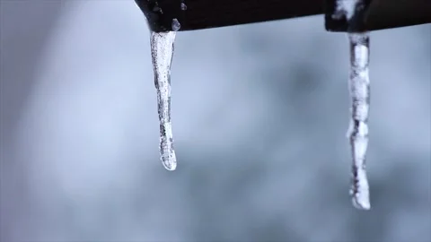 Icicles on edge of roof - close up Video stock 241584255
