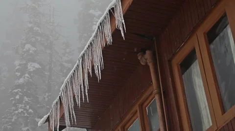 Icicles on the edge of the roof low-angle shot 動画素材 45795670