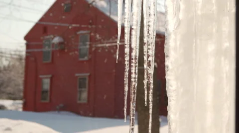 Icicles in Front of Red Farm House Stock Footage 47095098
