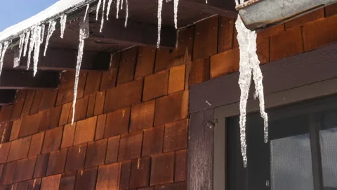 Icicles growing on cabin Stock Footage 167046555