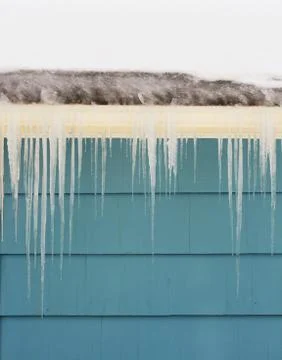 Icicles on gutter Foto stock