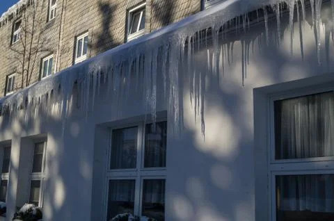 Icicles on a gutter Stock Photos