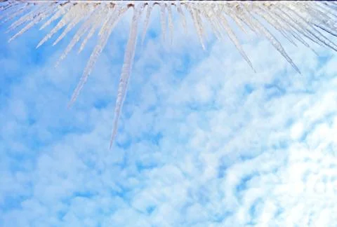 Icicles hanging from the edge Stock Photos