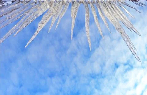 Icicles hanging from the edge Stock Photos