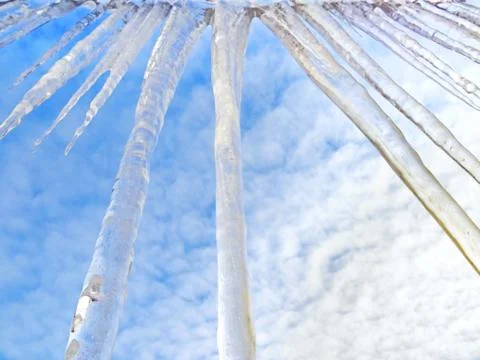 Icicles hanging from the edge Stock Photos