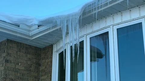 Icicles Hanging off Gutter in Front of Bay Window - House Stock Footage 322837786