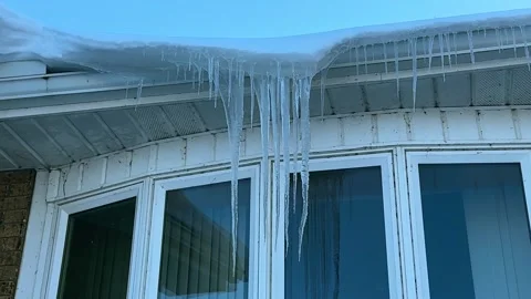 Icicles Hanging off Gutter in Front of Bay Window - House Stock Footage 322837820