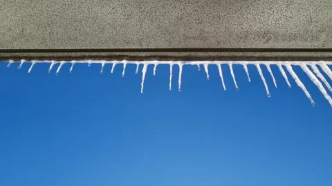 Icicles hanging from the roof Stock Footage 334940056
